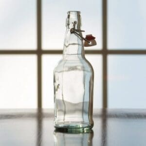 Clear glass bottle with swing top lid.