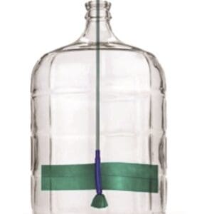 Glass carboy with a cleaning brush.