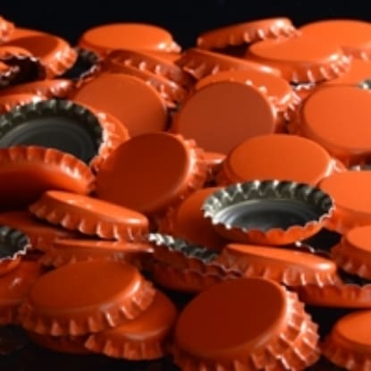 Pile of orange bottle caps.