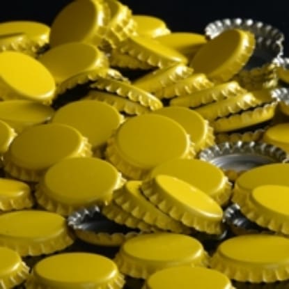 Pile of yellow bottle caps.