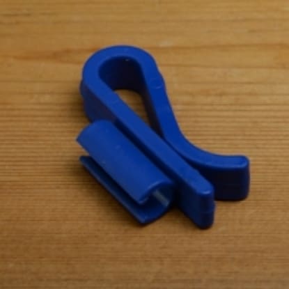 Blue plastic S-shaped clip fastener.