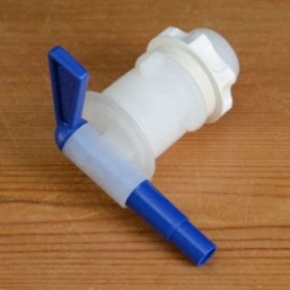 White plastic spigot with blue handle.