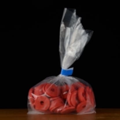 Plastic bag filled with red rubber washers.