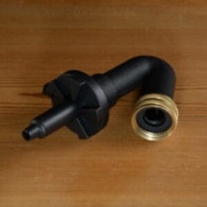 Black plastic hose adapter with brass fitting.