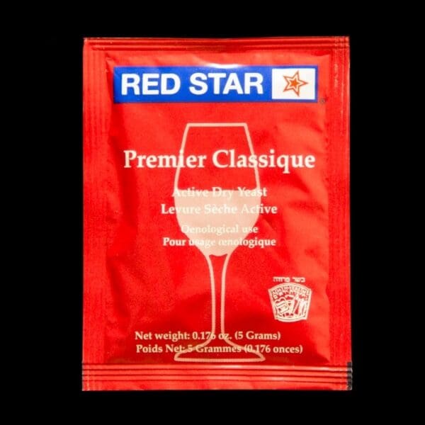 A red star wine bag with a glass of wine on it.