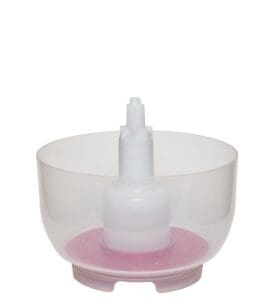 White plastic pump bottle with pink base.