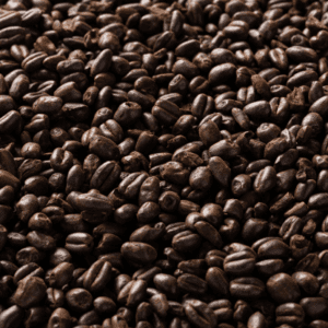 A close up of coffee beans on the ground