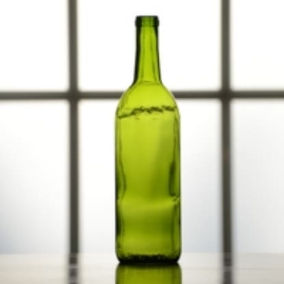 Empty green glass wine bottle.