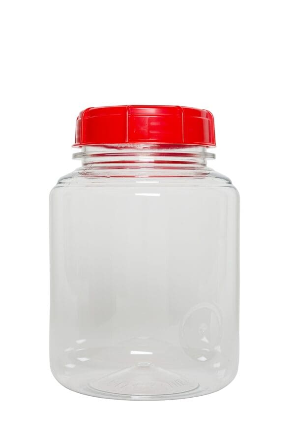 Empty plastic jar with red lid.